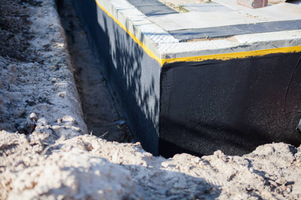 Professional Basement Waterproofing technician working in Richboro, PA